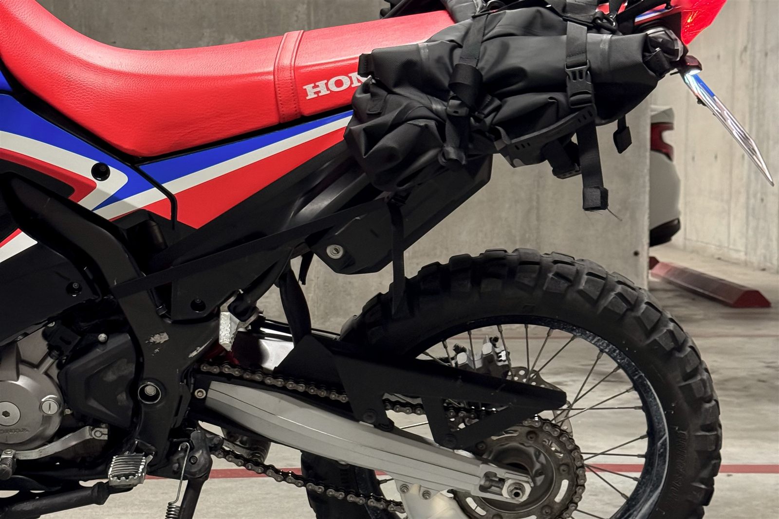 Left side view of Honda CRF300L Rally motorcycle rental