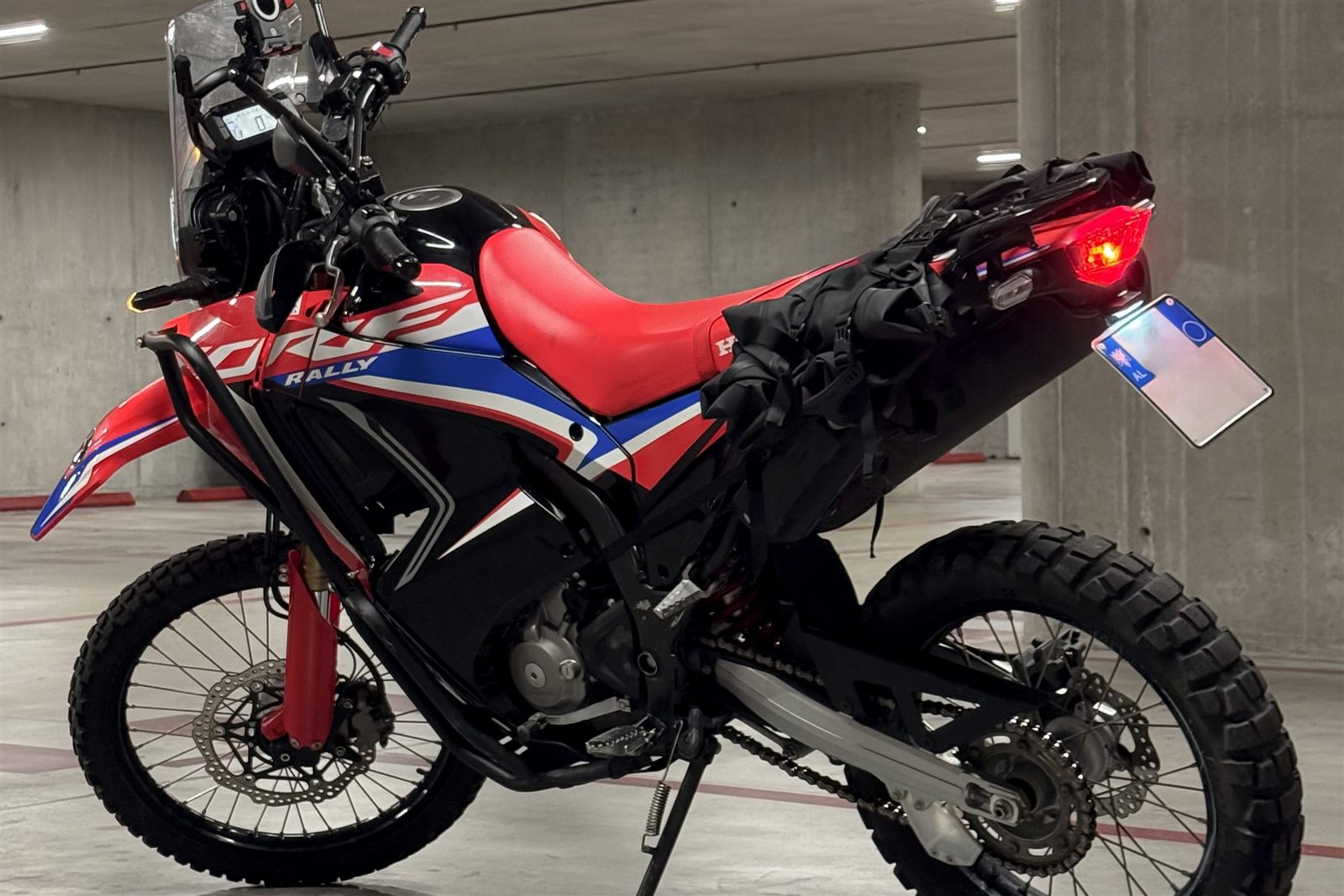 Rear view of Honda CRF300L Rally motorcycle rental