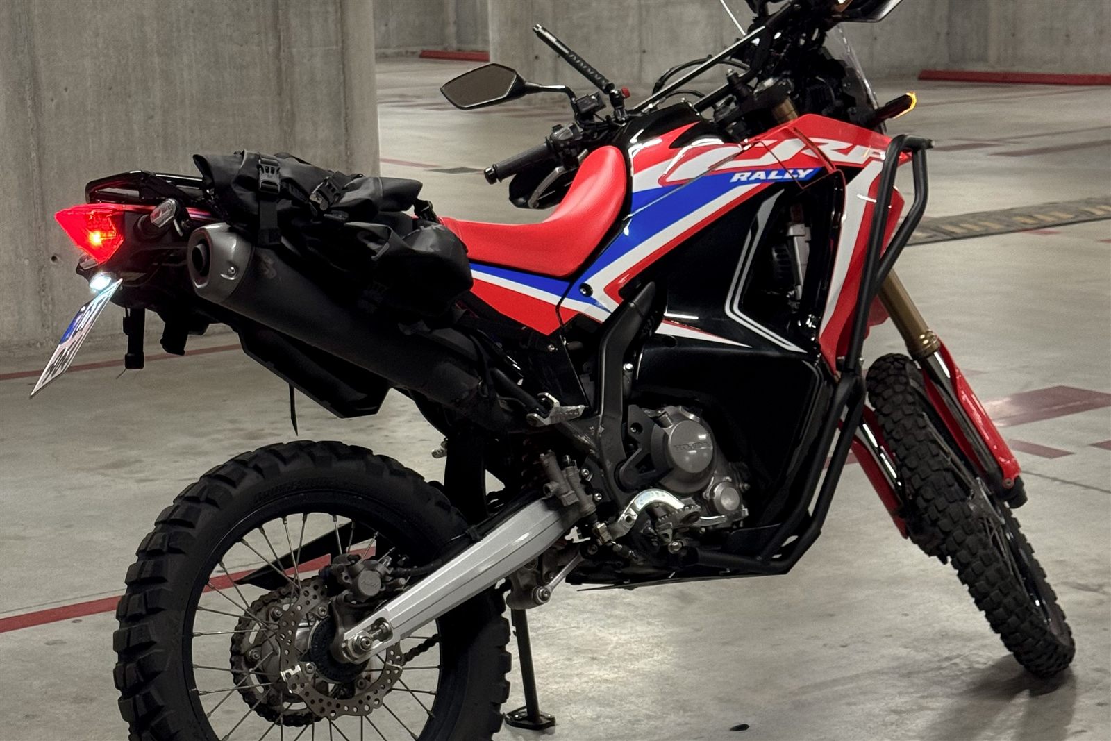 Right side view of Honda CRF300L Rally motorcycle rental
